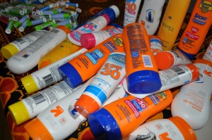 Photo of donated bottles of sunscreen and lip balm