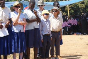 Photo of The Kabanga Choir performing "Why Are We Refugees in Our Own Country?"